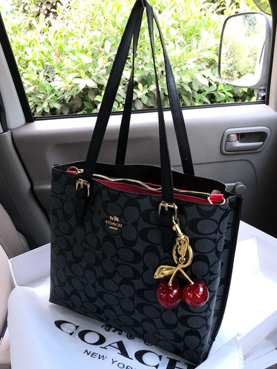 Coach Mollie tote bag with Cherry keychain Grey