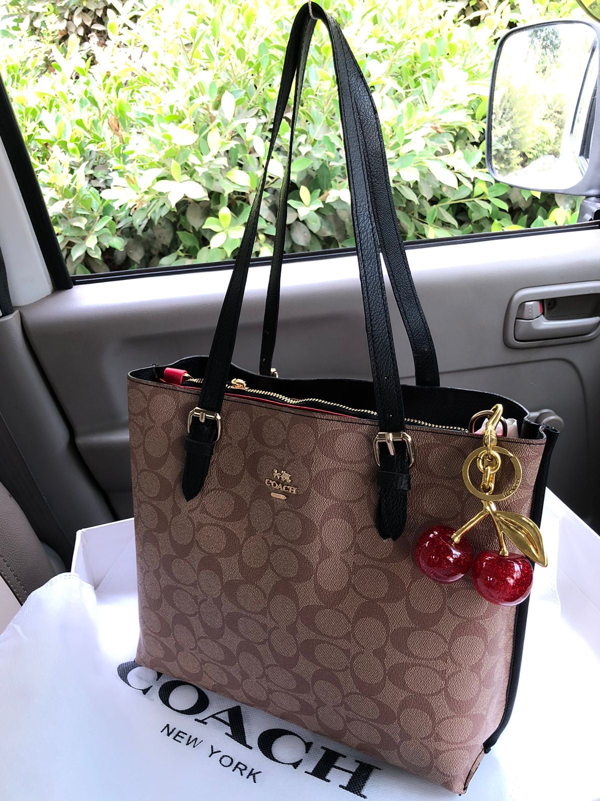 Coach Mollie tote bag with Cherry keychain