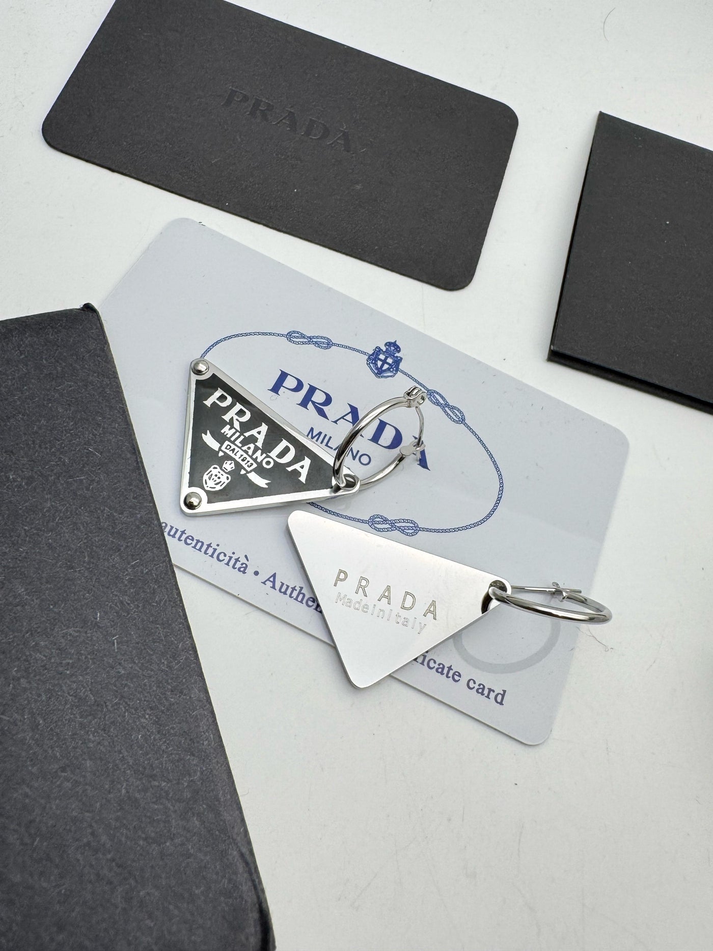 Prada Symbole Triangle Pendant right earring