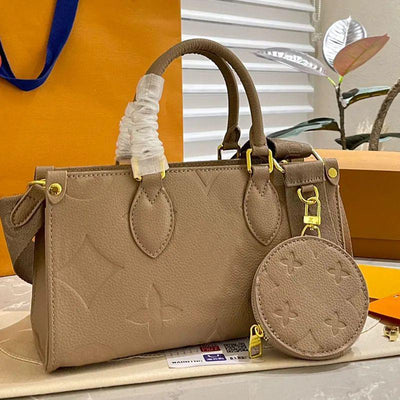 Louis Vuitton LV on the go Bag With belt and coin pouch Beige