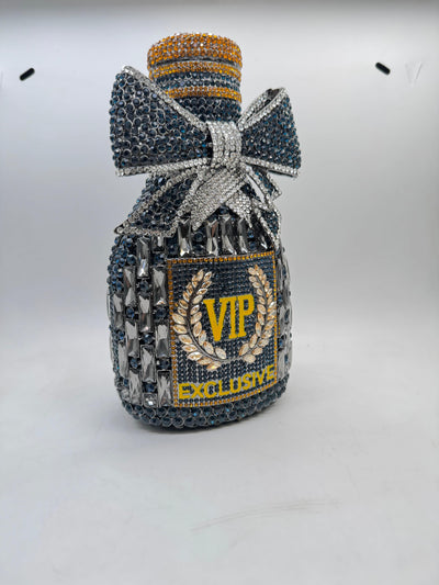 rhinestone-embellished clutch bag shaped like a bottle, with a bow and the text for Women